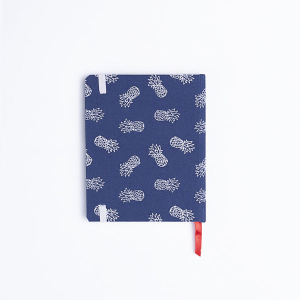 Catalina Sanchez handmade blue and white pineapple notebook with red bookmark.