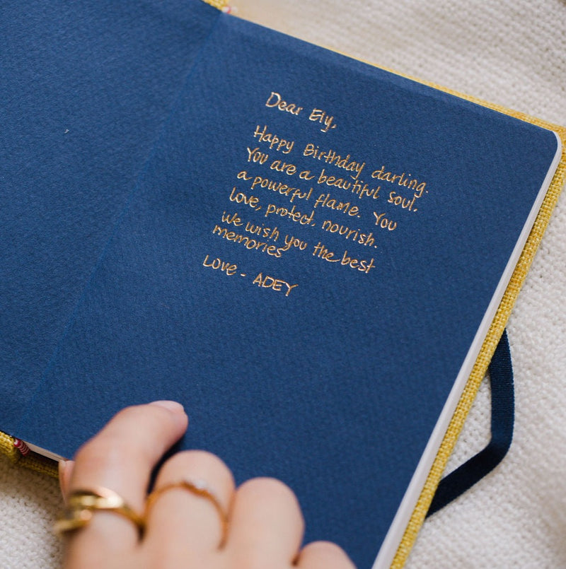 A custom inscription on the inside cover of a handmade Catalina Sanchez notebook. 