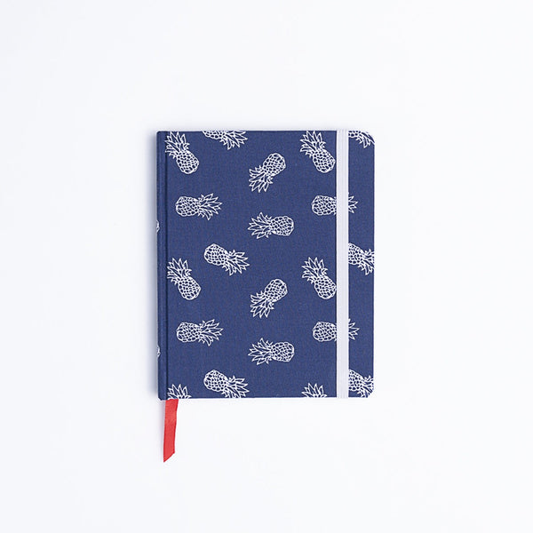 Catalina Sanchez handmade blue and white pineapple notebook with red bookmark.
