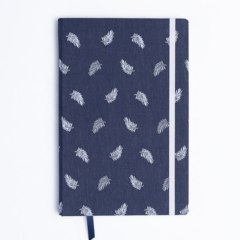 Catalina Sanchez handmade blue and white feather notebook with blue bookmark.