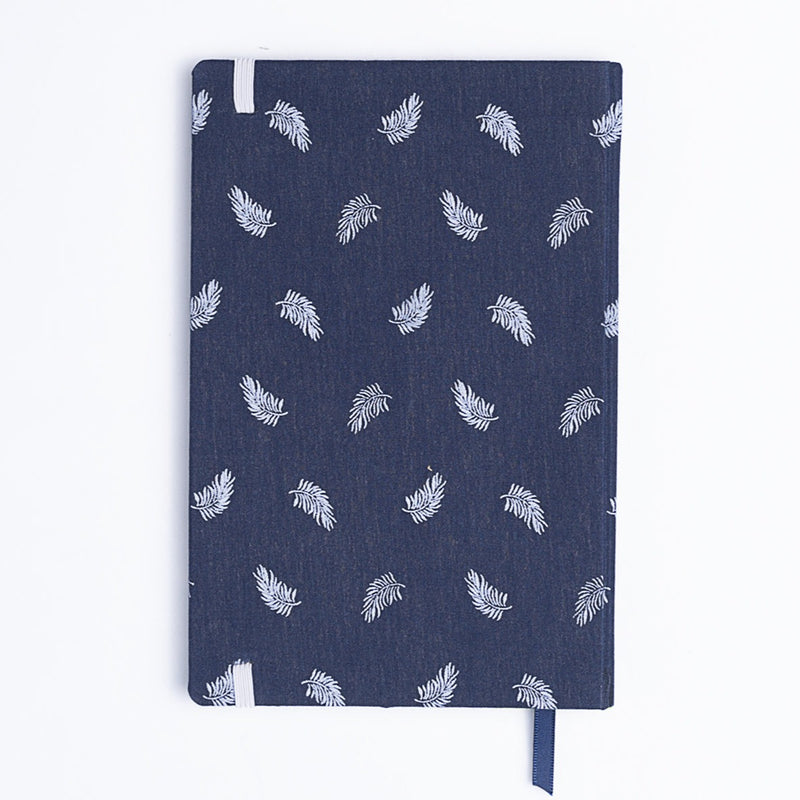 Catalina Sanchez handmade blue and white feather notebook with blue bookmark.