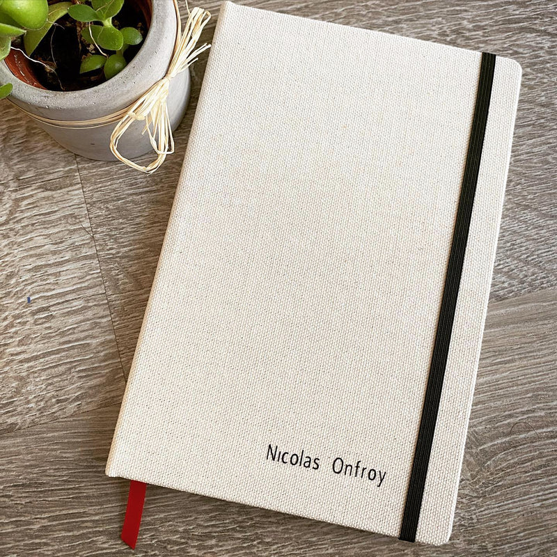 White, hardcover, handmade canvas notebook with name from Catalina Sanchez